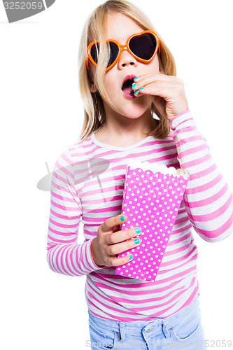 Image of Girl eating pop corn