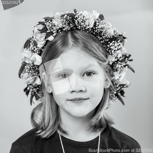 Image of Portrait of a little girl with garland