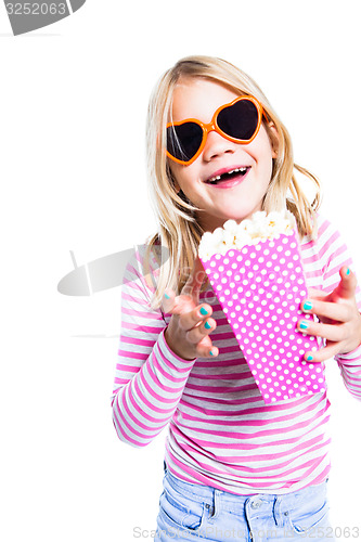 Image of Girl eating pop corn