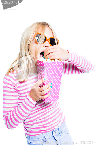 Image of Girl eating pop corn