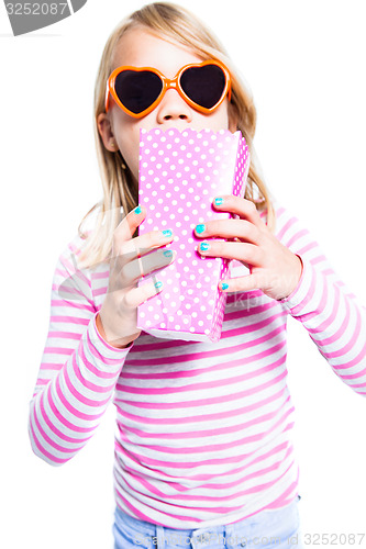 Image of Girl eating pop corn