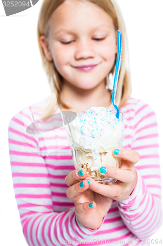 Image of Girl holding ice cream dessert