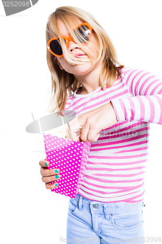 Image of Girl eating pop corn