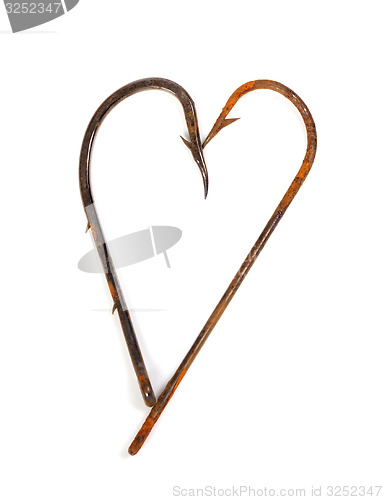 Image of Old rusty fish hooks in form of heart