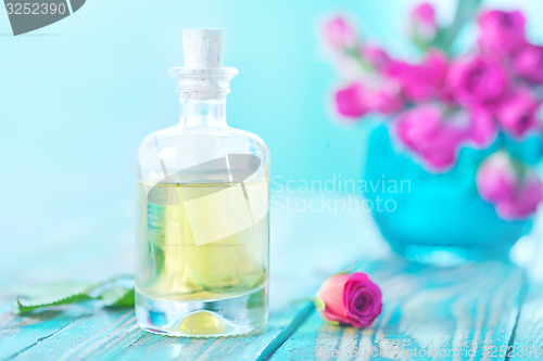 Image of rose oil in glass bottle