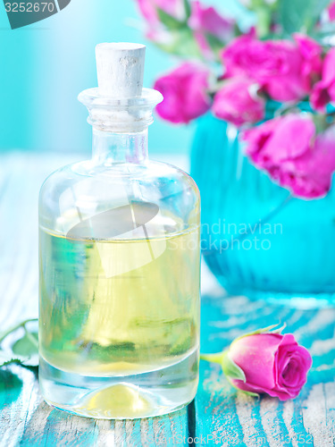 Image of rose oil in glass bottle