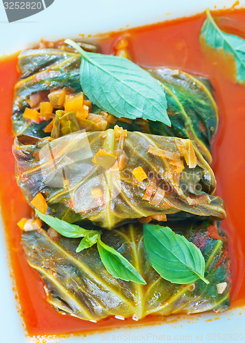 Image of dolma with tomato sauce