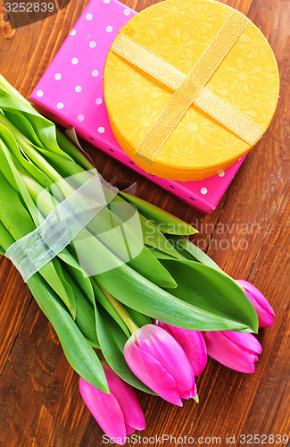 Image of present and tulips