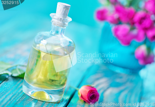 Image of rose oil in glass bottle