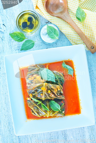 Image of dolma with tomato sauce