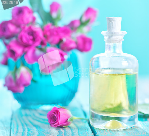 Image of rose oil in glass bottle
