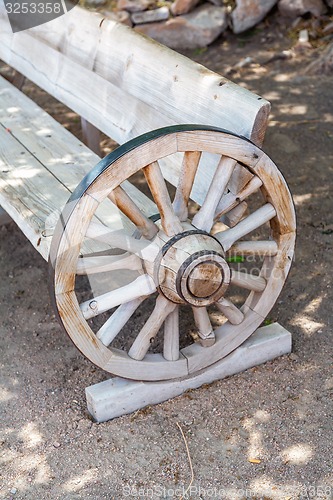 Image of antique bench made from carriage wheel 