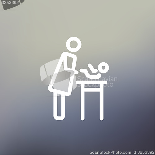 Image of Woman changing the diaper thin line icon