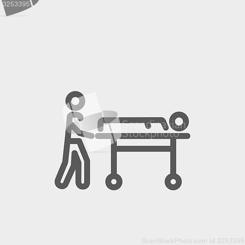 Image of Man pushing the stretcher with sick person thin line icon