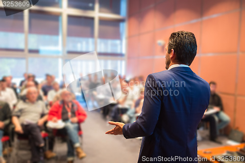 Image of Speaker at Business Conference and Presentation.