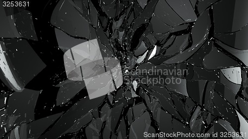 Image of Pieces of broken or cracked glass on black