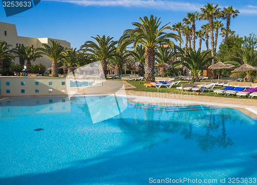 Image of Large Swimming pool and trees at resort