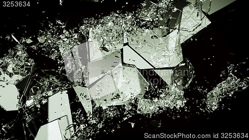 Image of Pieces of broken or demolished glass on black