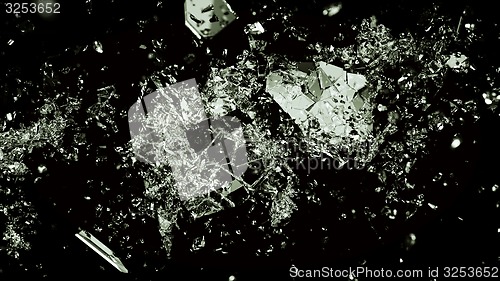 Image of Pieces of splitted or broken glass on black