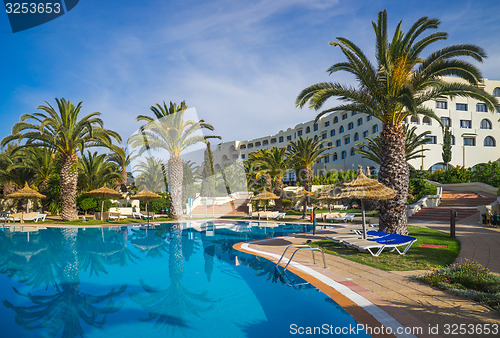 Image of swimming pools and hotel at luxury resort