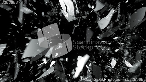 Image of Pieces of broken glass on black with motion blur