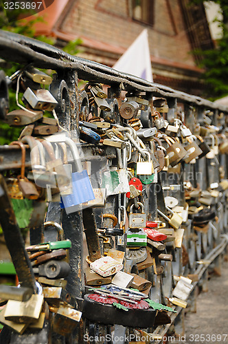 Image of Locks on a bridge railing