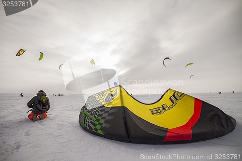 Image of Kiteboarder with kite on the snow