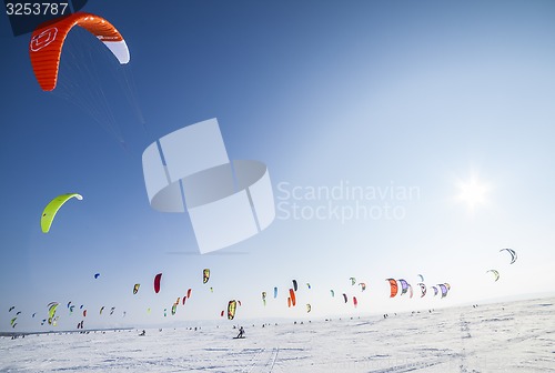 Image of Kiteboarder with kite on the snow