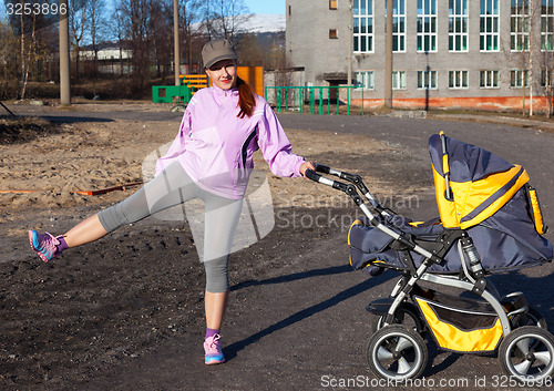 Image of young woman in suit fitness aerobics