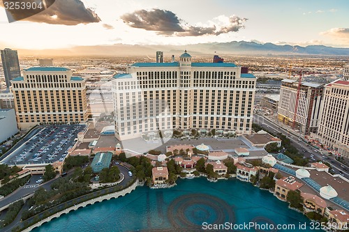 Image of LAS VEGAS, USA - Feb 13, 2009 Bellagio Hotel Casino reflection in the water at sunset, Las Vegas, 