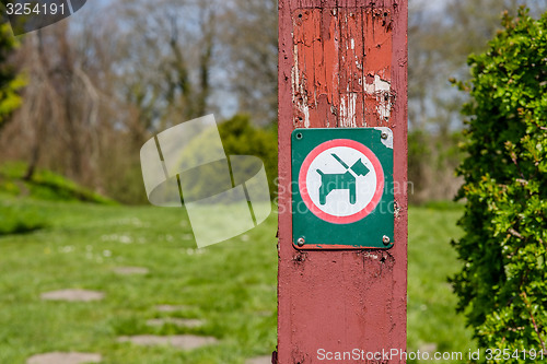 Image of Dog in leash sign