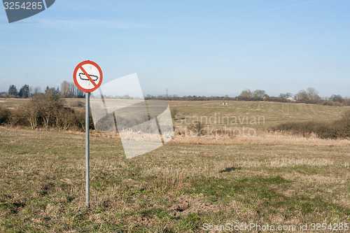 Image of Forbidden tank sign on a field