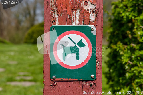 Image of Sign with a dog in a leash