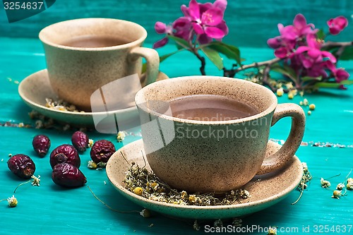 Image of tea brewed with chamomile in ceramic mugs