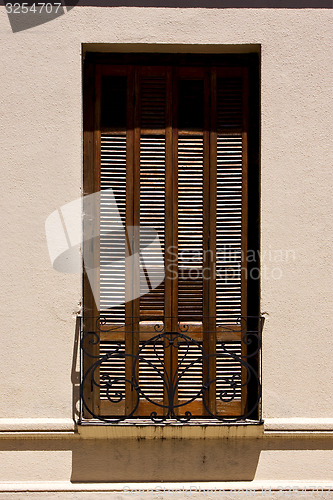 Image of old window grate and terrace