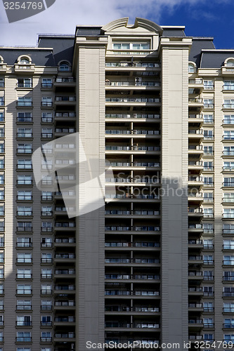 Image of skyscraper clouds and office