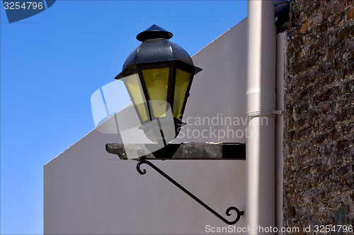 Image of  street lamp and a water pipe in colonia del sacramento