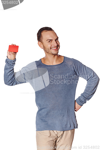 Image of Smiling casual man showing blank credit card