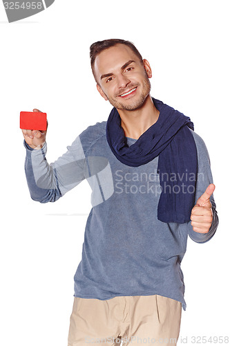 Image of Smiling casual man showing blank credit card