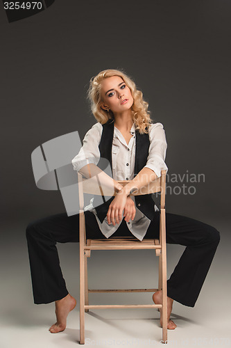 Image of Beauty blond woman on chair