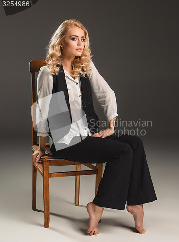 Image of Beauty blond woman on chair