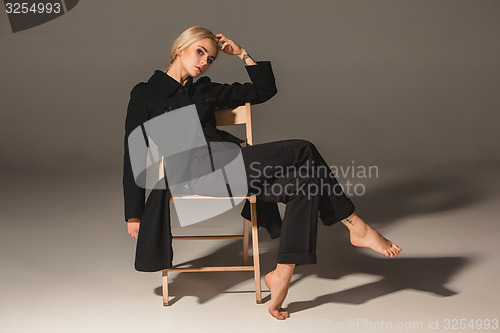 Image of Beauty blond woman on chair