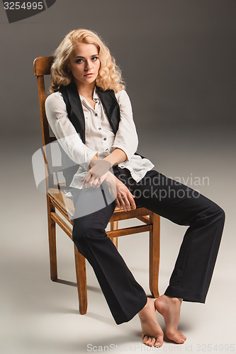 Image of Beauty blond woman on chair