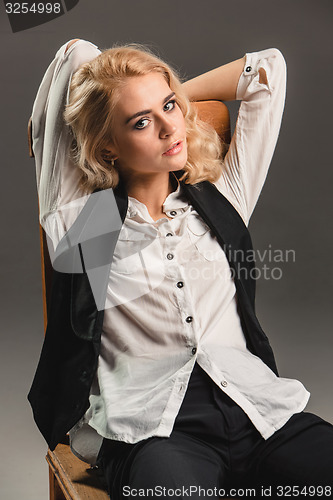 Image of Beauty blond woman on chair