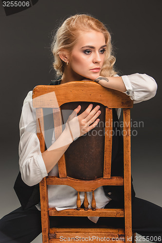 Image of Beauty blond woman on chair