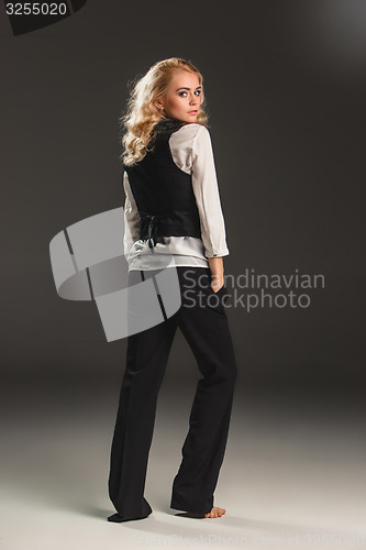 Image of Beauty blond woman on a gray background