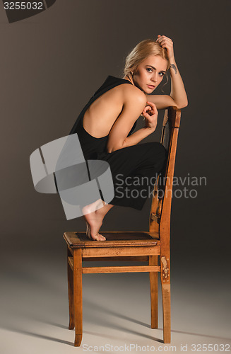 Image of Beauty blond woman on chair