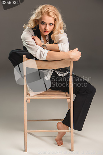 Image of Beauty blond woman on chair