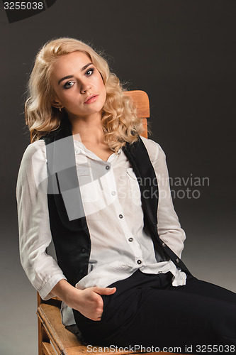 Image of Beauty blond woman on chair