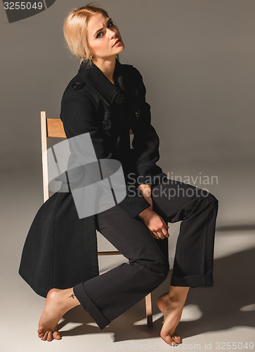 Image of Beauty blond woman on chair